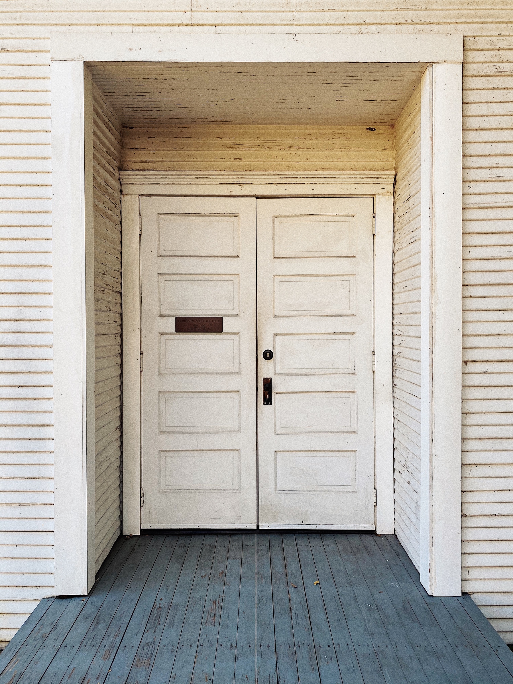 White doors, entrance to church at the Farmers Branch Historical Park